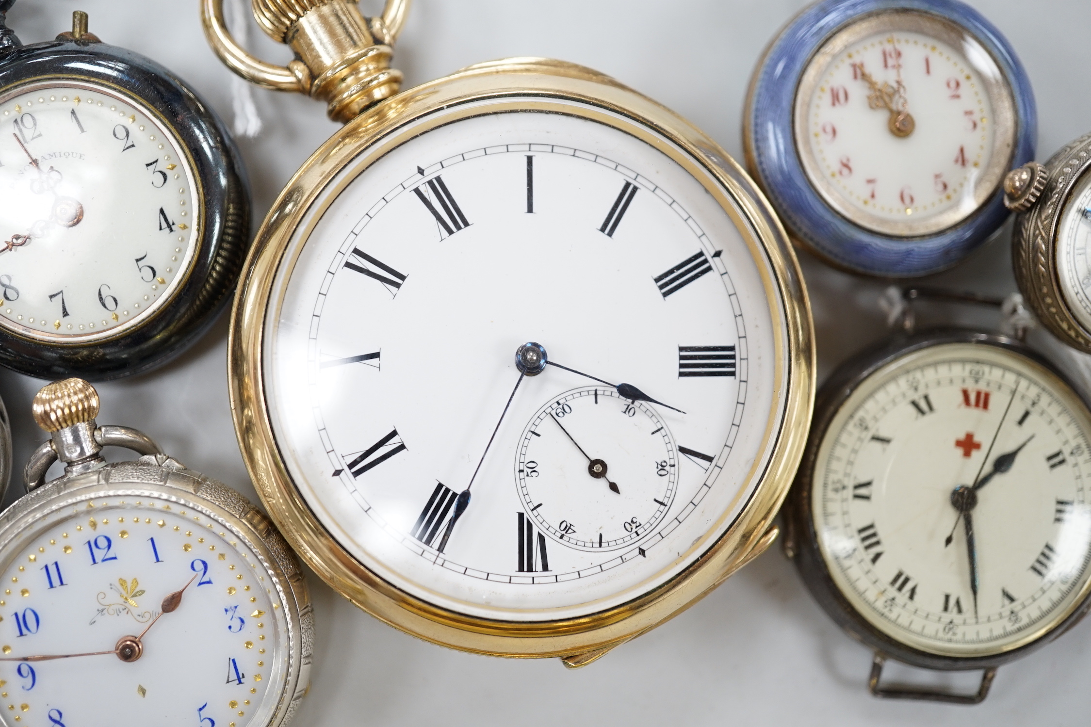 A gold plated open face pocket watch, a silver wrist watch, three fob watches including Art Nouveau 935 and enamelled and a globe watch.